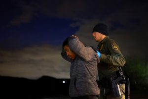 A migrant is detained by a U.S. Border Patrol agent in Sunland Park, New Mexico, on November 4, 2024. Jose Luis Gonzalez (REUTERS)